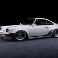 White Classic Porsche Sports Car With Widebody Black Wheels And Brown Interior
