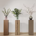 Three Vases Pink Transparent Glass And Gray With Flowers On Wooden Pedestals White Wall