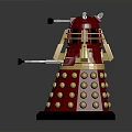 Red Metallic Robot Figure With Gold Spherical Bumps And Protruding Arm