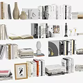 Stylish Books And Magazines Collection Display With Open Book Vase And Sculpture
