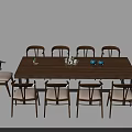 Wooden Conference Table Surrounded by Light Upholstered Chairs With Blue Teapot and Decorative Items