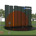 Outdoor Stage Setup With Orange Circular Structure Glass Curtain Wall And Lighting Equipment At Sunset