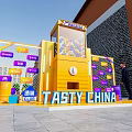 Tasty China Themed Yellow Installation With Colorful Balls Purple Signs Green Plants And Brick Wall