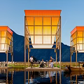 Scenic Waterfront Campsite With Orange Roofed Structures Mountain Views And Reflections