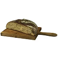 Freshly Baked Artisan Bread with Crusty Exterior on Wooden Cutting Board