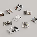 Open Interior Design Magazines Display Room Furniture Photos Scattered on Gray Background
