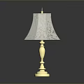 Elegant Table Lamp With Gold Base And White Fabric Lampshade On Shiny Surface