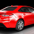 Red Toyota Sedan With Shiny Red Exterior And Modern Front Design