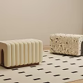 Two Stylish Shoe Benches With Ribbed And Patterned Designs On Black Square Pattern Rug