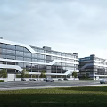 Modern Multi Storey Industrial Factory Building Featuring Large Glass Windows And Green Surroundings