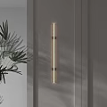 Modern Elongated Wall Light With Warm LED Glow Beside Green Leaf Plant In Home