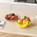 Fresh Mixed Fruits In Glass Bowls On Modern Kitchen Countertop With Coffee Cup And Magazine