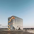 Modern Glass Facade Library Building With Orange Spiral Staircase Open Surroundings And Parking Lot
