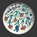 Decorative White Plate With Green Red Blue Floral Patterns And Reflection On Black Background