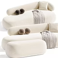 Beige And Green Tiger Patterned Irregular Shaped Sofa With Round Cushions And Plaid Blanket