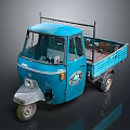 Blue Three Wheeled Cargo Truck With Open Bed And Metal Frame Cab