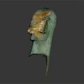 Ancient Greenish Bronze Mask Featuring Golden Accents And Intricate Facial Details