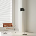 Modern Black Floor Lamp With Metal Stand Next To Brown Chair And White Blinds