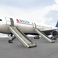 Delta Airline Airplane With Open Doors And Deployed Slides On Tarmac Under Cloudy Sky