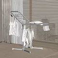 Sturdy Modern Clothes Rack With Hanging Clothes Near Window Blinds And Curtains On Carpet