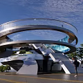 Modern Spiral Road Infrastructure With Glass Railings Metal Framework Pedestrian Stairs And Surrounding Trees