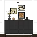 Black Decorative Cabinet with Top Ornaments and Modern Wall Art in White Minimalist Interior