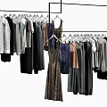 Various Hanging Clothes on Racks with Long Sleeves Dresses Pants and Multiple Colors