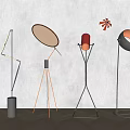 Modern Floor Lamps With Various Geometric Stands And Illuminated Shades On Minimalist Background