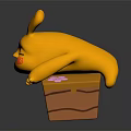 Yellow Cartoon Rabbit Character With Red Cheek Mark Lying On Brown Base With Pink Flower