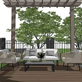 Outdoor Sofa With Armchairs Coffee Table On Wooden Deck Under Pergola Green Trees And Purple Flowers