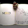 Tianji Academic Mansion Heritage Property Entrance With White Curved Archway Golden Decorations And Red Flowers