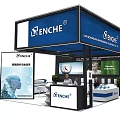 ENCHE Exhibition Booth with Blue White Design Display Screens Product Showcases and Staff Presence
