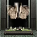 Commercial Equipment Including Elongated Pendant Chandelier and Architectural Model Display Stand in Dark Interior