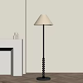 Modern Floor Lamp With Light Colored Shade Black Metal Pole Beaded Base In Minimalist Room