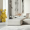 Modern Living Room With Light Gray Sofa Golden Bear Sculpture And Marble Fireplace
