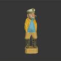 Man Figurine in Yellow Coat Blue Shirt with White Hat Black Boots on Yellow Base