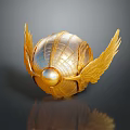 Intricate Golden Ornament With Shiny Wings And Central Pearl Design