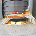 New Century Electrical Mall Event Entrance With Curved Design And Colorful Decorations