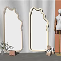 Elegant Modern Mirrors with Unique Shape in Room Featuring Striped Wall Mannequin and Figurines