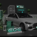 White Mercedes EQE Electric Vehicle Display With Green Plants And Brand Signage