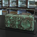 Bronze Radio Shaped Sculpture With Intricate Carving Details In Display Case