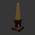 Tall Golden Topped Obelisk With Black Base And Ornate Decorative Elements