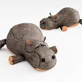 Stuffed gray hippo plush toys lying position with orange ears feet soft material