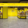 Supermarket Department Store Interior with Yellow Pillars Imported Snacks Candy Pastry Areas and Product Shelves