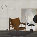 Brown Leather Accent Chair with Wooden Frame Near Floor Lamp Abstract Painting and Side Table