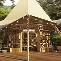 Outdoor Garden Landscape With Tent Structure Wooden Deck Bookshelves And String Lights