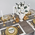 Elegant Dinnerware Set With Golden Cutlery White Flower Bouquet Gold Candle Holders And Glassware