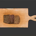 Fresh Sliced Bread on Wooden Cutting Board Against Black Background
