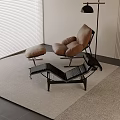 Brown Lounge Chair With Ottoman And Floor Lamp On Beige Rug Near Window Blinds