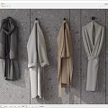 Minimalist Modern Coats In Dark Gray Light Gray And Beige Hanging On Gray Wooden Wall